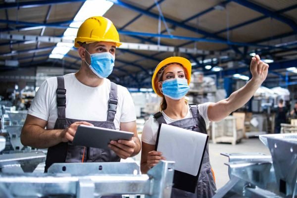 Quality-control-engineers-factory-workers-overlooking-floor-1600x1200